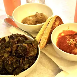 three bowls of food on a table