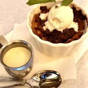 a bowl of dessert with ice cream and a spoon