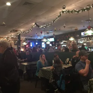 a crowd of people sitting at tables