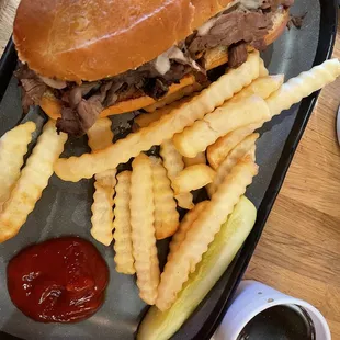 French Dip sandwich. I upgraded to fries instead of potato chips. Au jus dip is in the small white cup at lower right corner of photo. Yum!