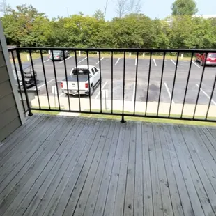 Given unit. Patio with no privacy and different rails as well as different and poor quality.