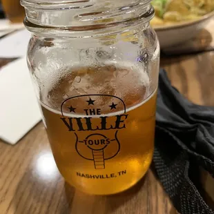 a glass of beer on a table