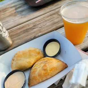 a plate of pastries and a glass of beer