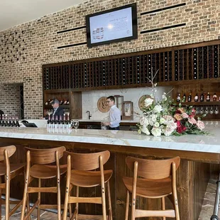 a woman sitting at a bar