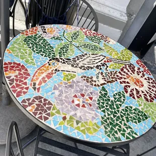 a mosaic table and chairs
