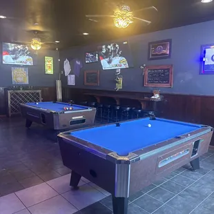 two pool tables in a restaurant