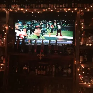 a bar with a large screen tv