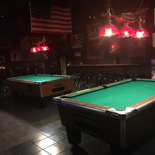 two pool tables in a bar