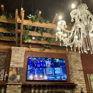 TVs along the bar. Cool decor!