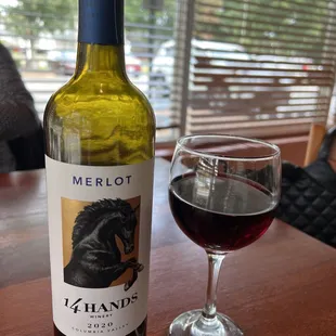a bottle of wine and a glass of wine