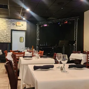 a dining room with tables and chairs