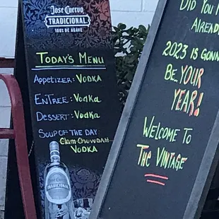 a chalk board and a sign