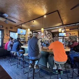 people sitting at the bar