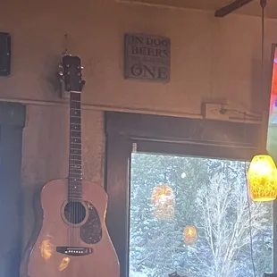 a guitar hanging from the ceiling