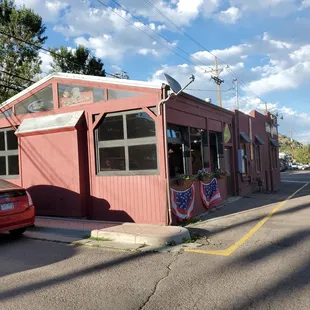 a red building on a street corner