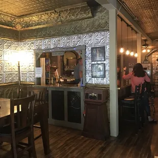 a woman sitting at the bar