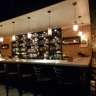 a bar with a lot of stools