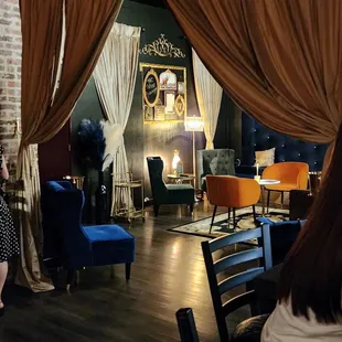 a woman standing in front of a fireplace