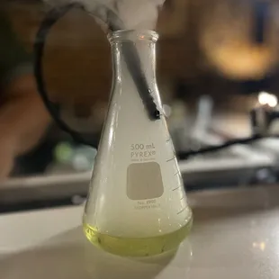 a flask with smoke coming out of it