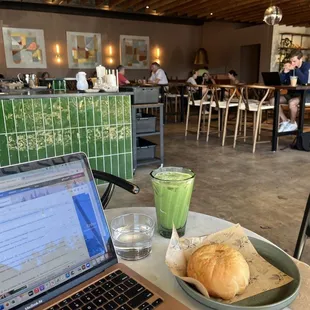 Matcha latte with oat milk and brisket/cheese kolache