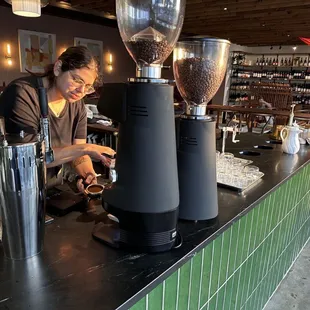 a woman pouring coffee