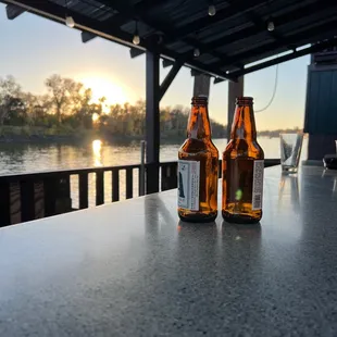 two bottles of beer on a table