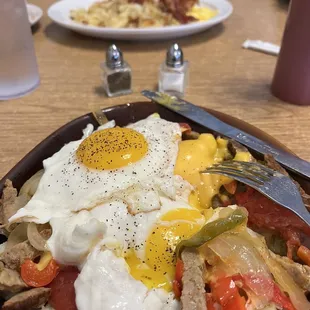 Top- bacon/eggs/home fries; bottom- skillet