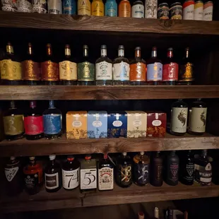 a shelf full of beer bottles