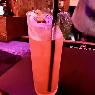 a tall glass of orange juice