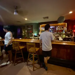 a group of people at a bar