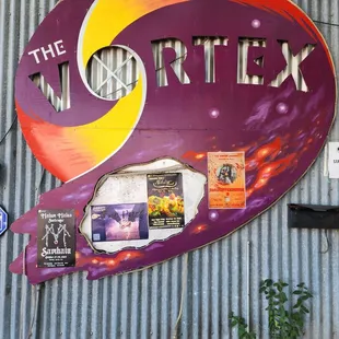 a colorful sign on the side of a building