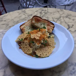 Charred Onion Tagliatelle with prosciutto, and Parmesan cheese.