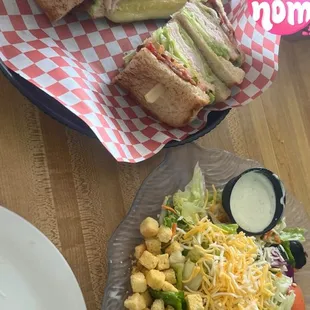 Club sandwich with side salad
