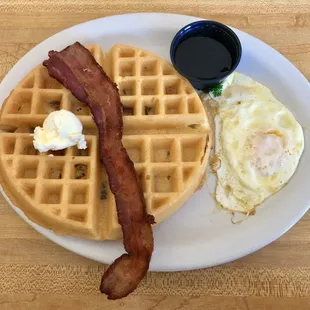 Bacon waffle and egg over easy (bacon in the waffle, too!). Crisp exterior, light and fluffy inside.