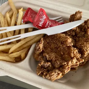 Fried chicken and waffle with fries