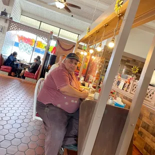 a man sitting at a counter