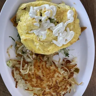 Chilequiles with scrambled eggs and hash browns