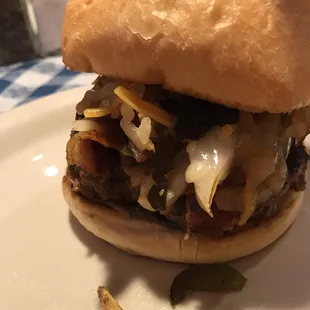 This is the Low Country Burger. It is a taste revelation! Onions, peppers, collard greens, bacon and ghost pepper cheese. Umami heaven!!