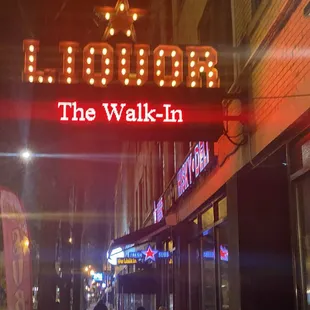 a neon sign for the walk - in