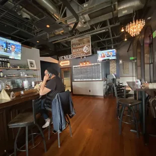 a woman sitting at a bar