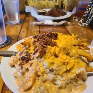 El Morsa- 2 biscuits with 2 eggs hard fried, chorizo  gravy and walrus fries enough for 2 to 3 people