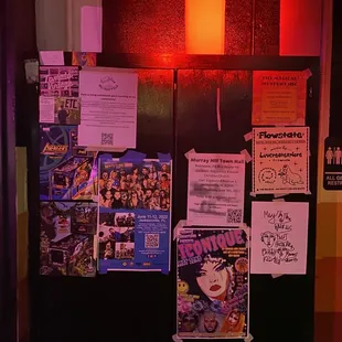 a bunch of posters on the wall