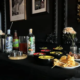 a table with drinks and snacks