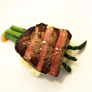 Steak rubbed with garlic salt, garlic whipped potatoes and asparagus