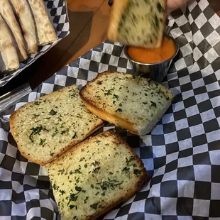 a person dipping cheese into bread