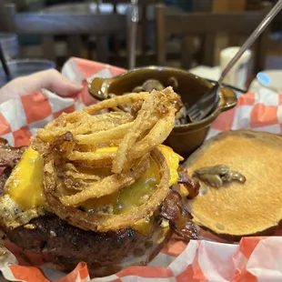 Burger with homemade onion rings, an egg and a perfect burger.