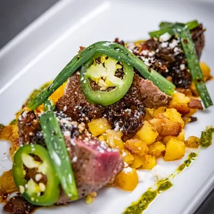 Pan Seared North American Elk Strip Loin - 
 Sweet Potato Hash, Chipotle Bacon Jam, Cilantro Walnut Pistou, Cotija, Grilled Scallion, Ja