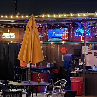 a bar with a yellow umbrella