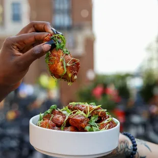 a woman holding a plate of food