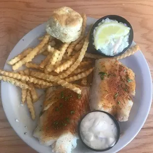 Baked cod, fries, biscuit, and coleslaw